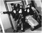 February 1989 pic: Nuneaton photographer Matt Page. Line up is (clockwise from rear left): Mark Mortimer (bass), Mark Allison (trumpet), Stuart Pickett (drums), Martin Cooper (trumpet, Eb trumpet), mannequin, Mark Brindley (vocals, guitar), Bryan Hurdley (trombone), Julian Amos (guitar, vocals).