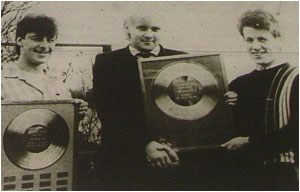 Lloyd Barnett (left) and Mark Mortimer receive their two MUSICBOX poll trophies from the column's editor Sam Holliday (centre).